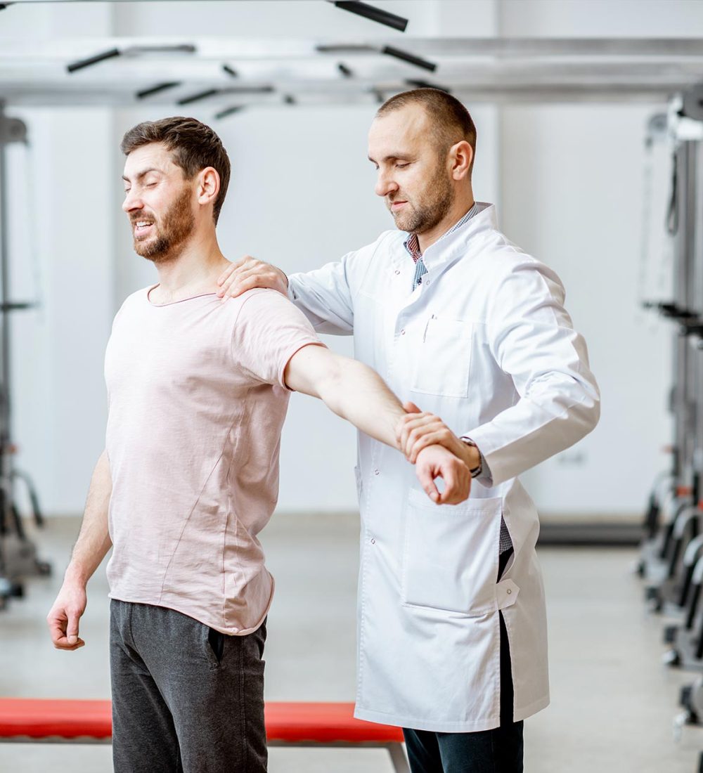 physiotherapist-doing-manual-treatment-to-a-man-2023-11-27-05-23-26-utc.jpg